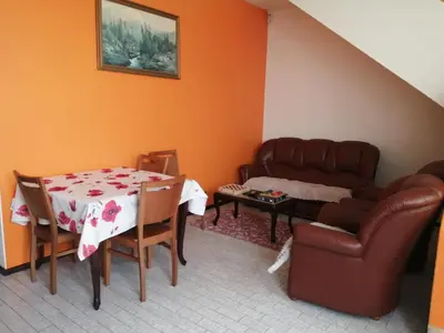 a living room with a couch and a table at Vista Boa in Porto da Cruz