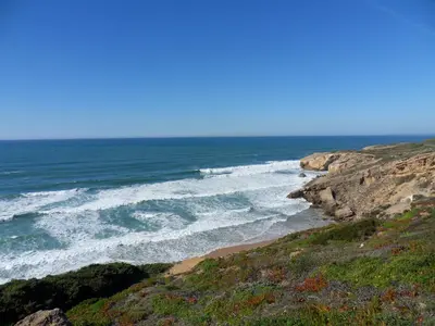 a view of the ocean from a bluff at Moradia Vale da Telha in Aljezur