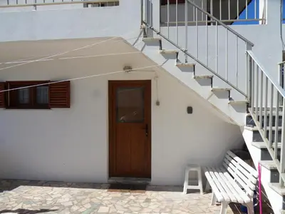 a stairway leading up to a door and a stair case at Moradia Vale da Telha in Aljezur