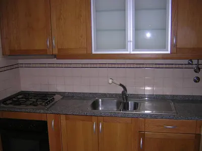 a kitchen with a sink and a stove at Sea Balcony in Funchal