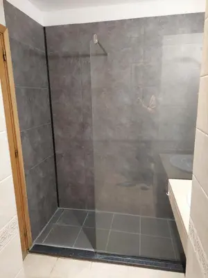 a shower with a glass door in a bathroom at Sea Balcony in Funchal
