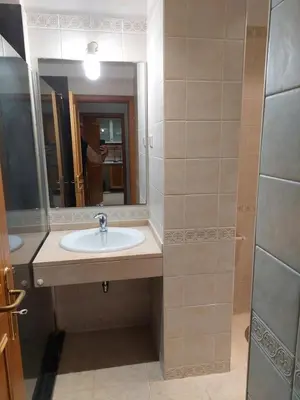 a bathroom with a sink and a mirror at Sea Balcony in Funchal