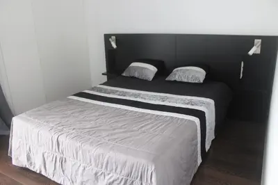 a bedroom with a bed with a polka dot sheet at Villa Girasol in Arco da Calheta