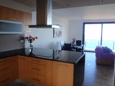 a bathroom with a sink and a toilet at Villa Girasol in Arco da Calheta