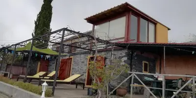 a house with a roof that has windows on it at Ocean View Cottage in Arco da Calheta