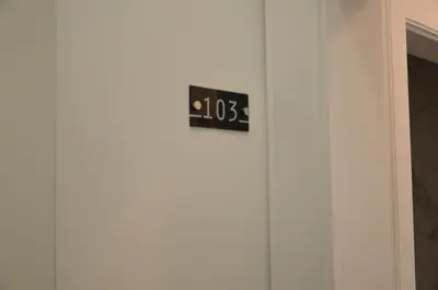 a clock on the side of a door at Edificio Charles 103 in Funchal