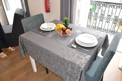 a table with a bowl of fruit on top of it at Edificio Charles 103 in Funchal