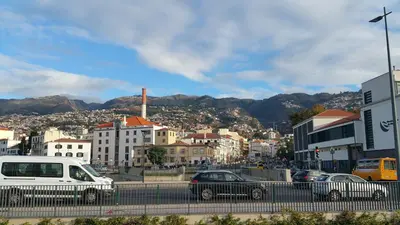 a city with cars parked on a street at Edificio Charles 206 in Funchal