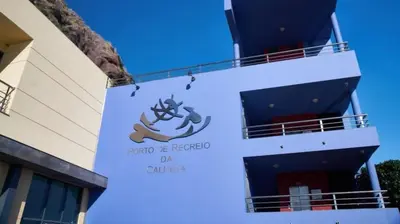 a sign on the side of a cruise ship at Marina Rooms in Calheta