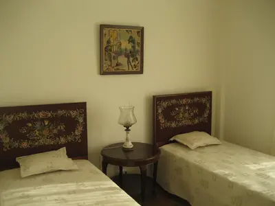 two beds sitting next to each other in a room at Yourpenthouseinmadeira in Funchal