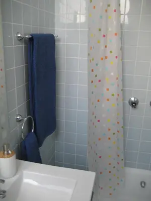 a bathroom with a sink and a shower curtain with polka dots at Yourpenthouseinmadeira in Funchal