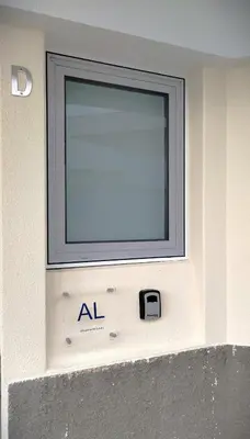 a window on the side of a building at Porto Santo - Pedras Pretas Beach House in Porto Santo