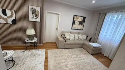 a living room with a couch and a table at Casa da Grota in Porto Moniz