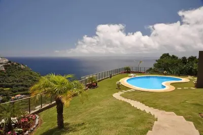 a swimming pool with a view of the ocean at Plaza Bay Luxury Apartment with Swimming Pool in Estreito da Calheta