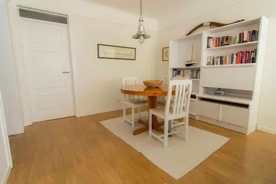 a dining room with a table and two chairs at Cliff View III - Sea View + Pool + Wifi in Funchal