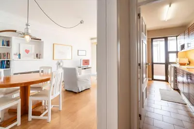 a kitchen and dining room with a table and chairs at Cliff View III - Sea View + Pool + Wifi in Funchal