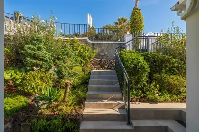 a set of stairs in a garden with bushes at OurMadeira - Villa Aquarela in Caniço