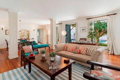 a living room with a couch and a table at OurMadeira - Quinta D'Alegria in Funchal