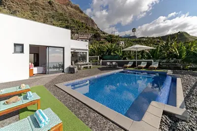 a villa with a swimming pool in a yard at OurMadeira - Grayci's House in Arco da Calheta