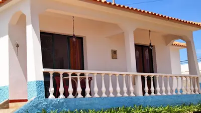 a villa with a balcony on the beach at OurMadeira - Villa Mary in Porto Santo