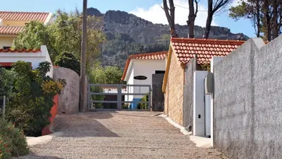a pathway leading to a house with a fence at OurMadeira - Villa Mary in Porto Santo