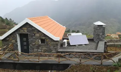 a small house with a solar panel on top of it at Refúgio da Xamusca in São Vicente