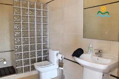 a bathroom with a toilet and a sink at OurMadeira - The Designhouse in Arco da Calheta