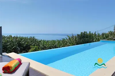 a swimming pool in a villa with a view at OurMadeira - The Designhouse in Arco da Calheta