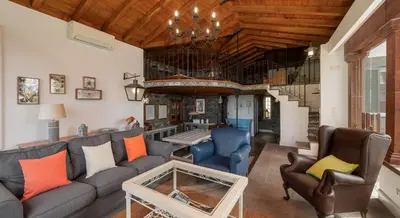 a living room with a couch and chairs at OurMadeira - Villa do Mar I in Arco da Calheta