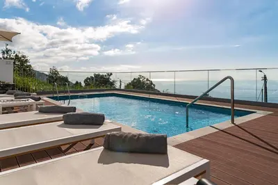 a swimming pool on top of a building at OurMadeira - Vila da Portada in Funchal