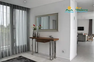 a bathroom with a sink and a mirror on the wall at OurMadeira - Calheta Heights in Calheta