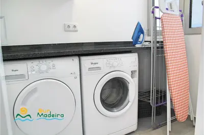 a white washing machine in a laundry room at OurMadeira - Calheta Heights in Calheta