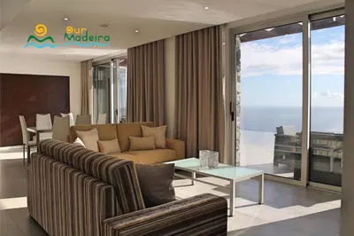 a living room with a couch and a table at OurMadeira - Cliffscape in Estreito da Calheta