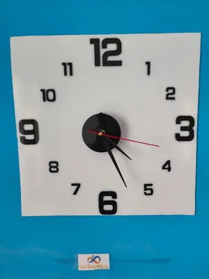 a white clock with black numbers on a blue background at PORTO SANTO MyLove in Porto Santo