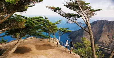a group of people standing on a mountain overlooking the ocean at PORTO SANTO MyLove in Porto Santo