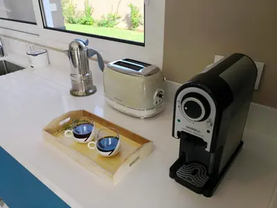a coffee maker sitting on top of a counter at NEW! Villa Alvinho| Lifestyle&Nature | Heated Pool in Funchal