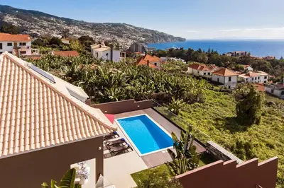 a view of a villa with a swimming pool at NEW! Villa Alvinho| Lifestyle&Nature | Heated Pool in Funchal