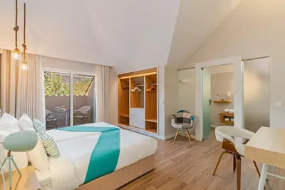 a bedroom with a bed and a desk and a table at NEW! Villa Alvinho| Lifestyle&Nature | Heated Pool in Funchal