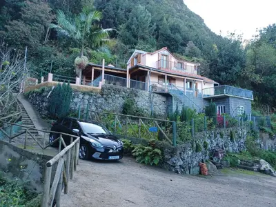 a car parked in front of a house at Fantatic Holiday House in Ponta Delgada