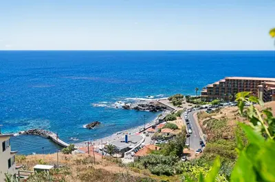 a view of a beach with the ocean at Reis Magos II by An Island Apart in Caniço