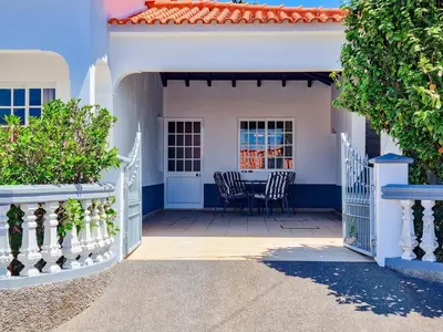 a porch of a house with a table and chairs at Casa da Achada in Arco da Calheta in Arco da Calheta