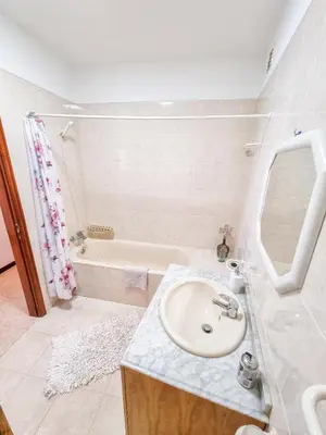 a bathroom with a sink and a bath tub at Casa da Achada in Arco da Calheta in Arco da Calheta