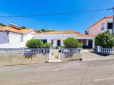 a white house with white fences and bushes at Casa da Achada in Arco da Calheta in Arco da Calheta