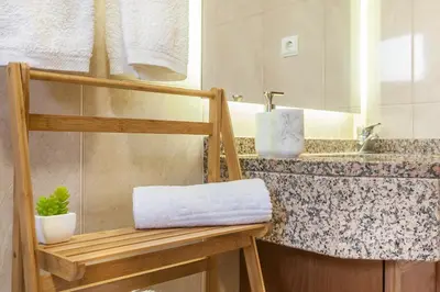 a bathroom with a sink and a towel rack at Blue Sky in Funchal