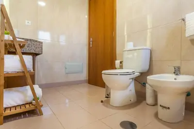 a bathroom with a toilet and a sink at Blue Sky in Funchal