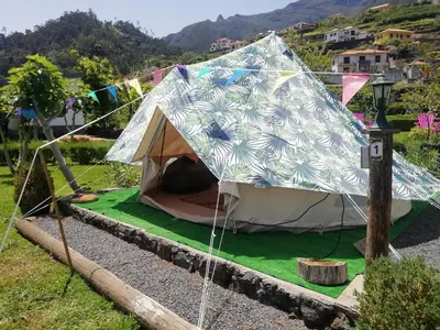 a tent set up on the side of a road at Granny's farm in São Vicente