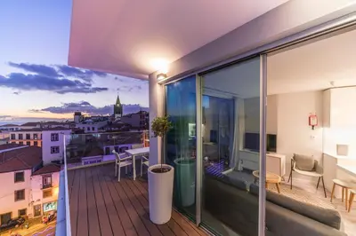 a balcony with a view of a city at FAA Rentals 31 de Janeiro by An Island Apart in Funchal