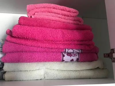 a stack of towels with a christmas tree on them at Casa Silva in Calheta