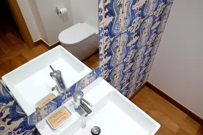 a bathroom with a sink and a toilet at Casas do Forte do Pico in Funchal