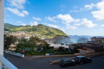 a view of a town and a mountain at Residencial Familia in Machico